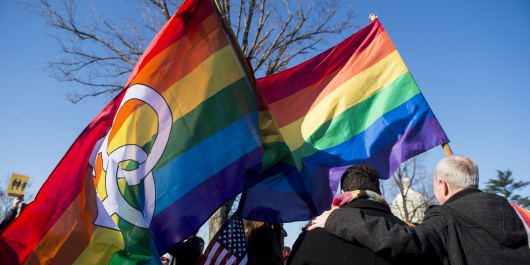 100701339-doma-protests-two-rainbow-flags-gettyp.530×298 Bill Clark | CQ Roll Call | Getty Images