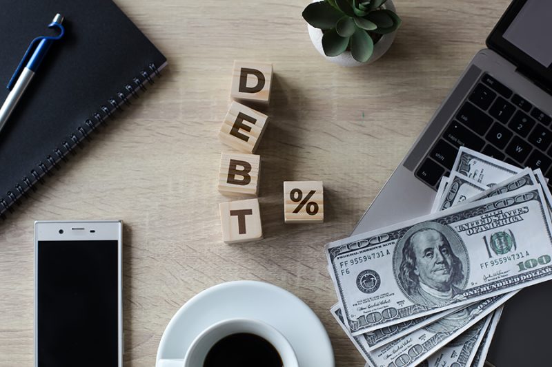 debt-inscription-with-dollar-bills-2023-11-27-05-21-55-utc