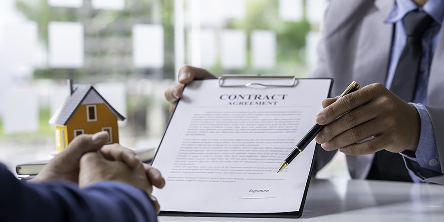 real-estate-agent-home-sales-broker-is-using-a-pen-2023-11-27-05-11-07-utc
